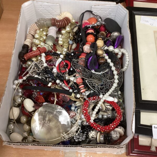 Costume jewellery lot featuring colourful beaded necklaces and chains.