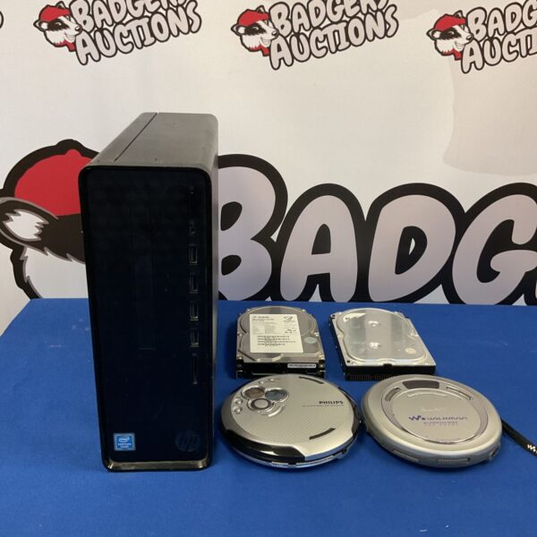 Mixed lot of Pentium Silver PC, Walkman CD players, and hard drives.