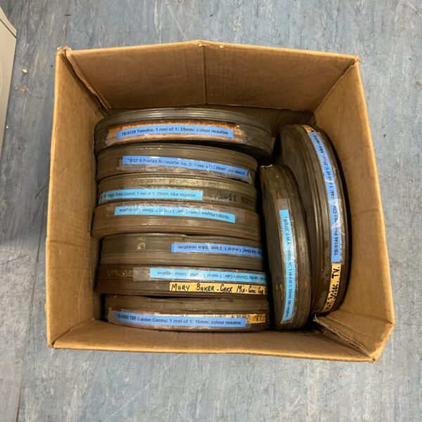 Vintage 35mm film reels used for cinema advertising and promotion.