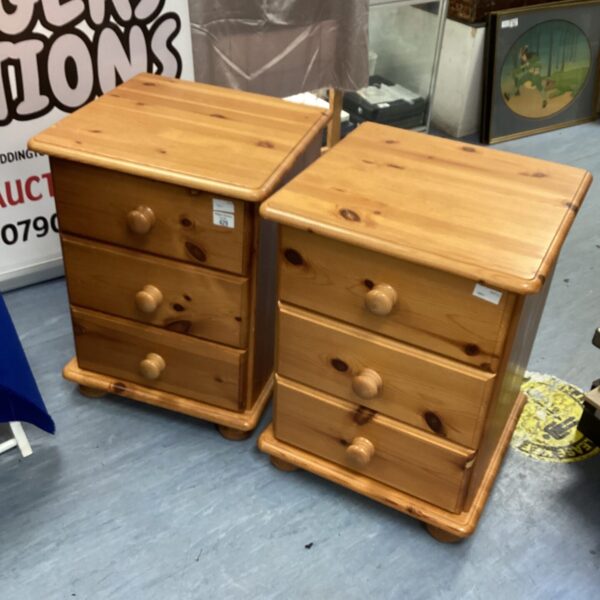 Pair of vintage pine bedside cabinets with three drawers.