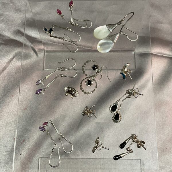 Diverse lot of twelve pairs of silver earrings.