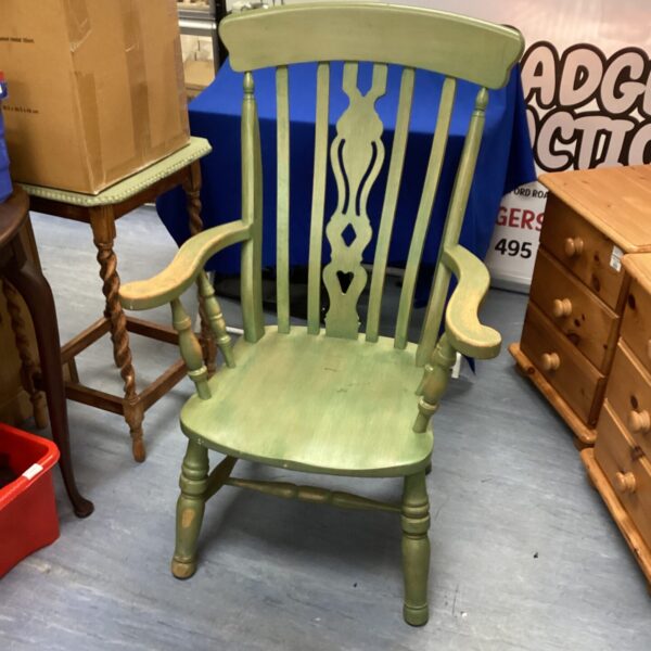 Vintage green grandfather chair with spindle back.