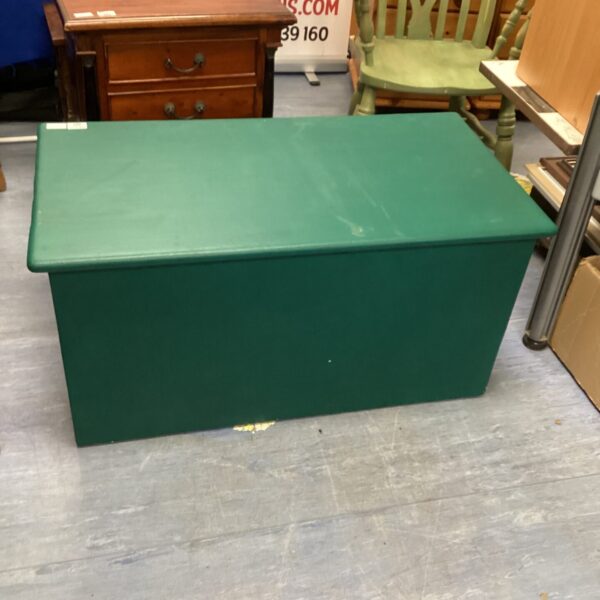 Large green wooden storage chest with a rustic finish.