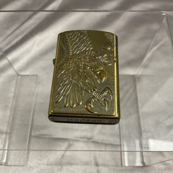Vintage Jadson brass petrol lighter with eagle design.