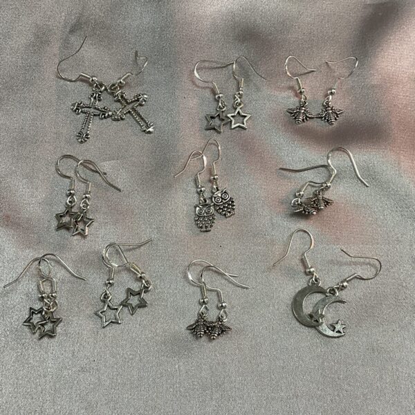 Silver earrings lot with diverse vintage designs.