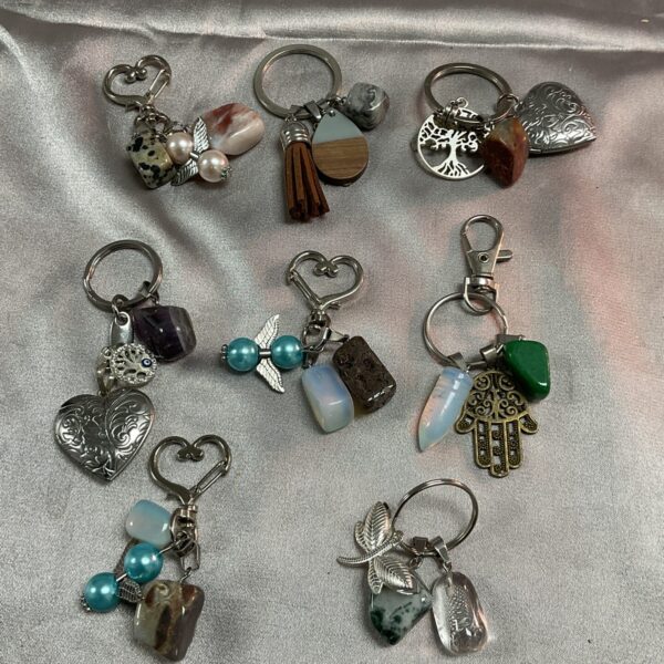 Lot of eight handmade semi precious stone keyrings with varied gemstones.