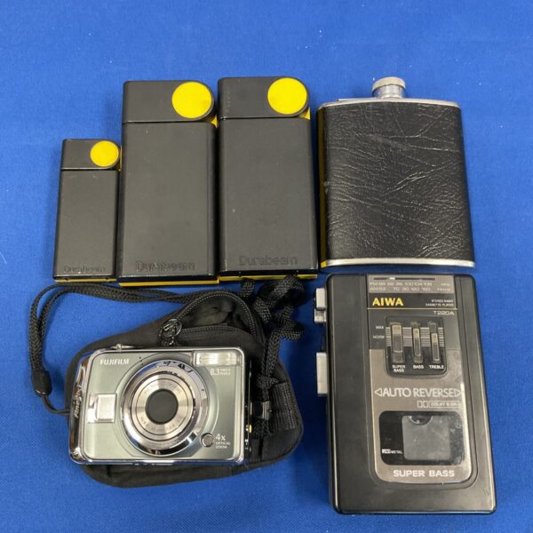 Vintage Fujifilm FinePix digital camera and Aiwa Walkman cassette player.