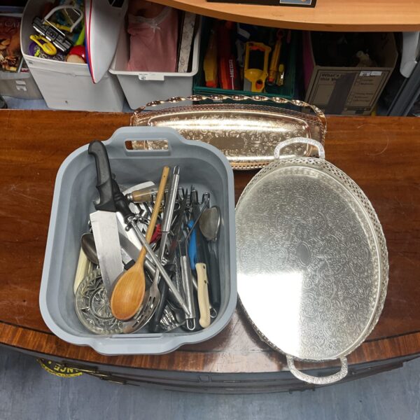 Mixed lot of stainless steel cutlery and serving trays.