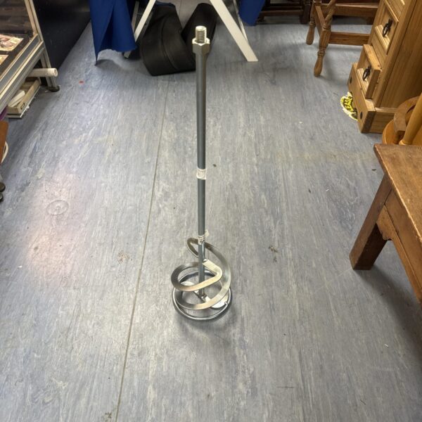 Metal plaster mixer whisk for blending construction materials.