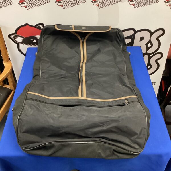 Black suit carry bag for travel and garment protection.