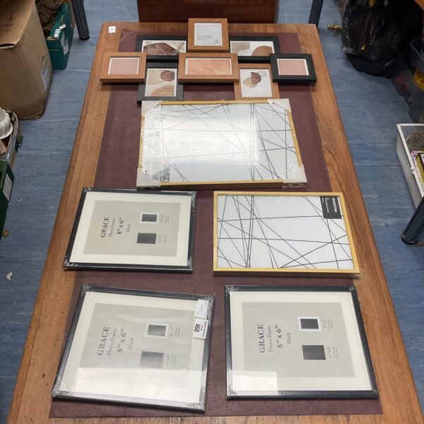 Mixed lot of vintage and assorted picture frames for wall decor.
