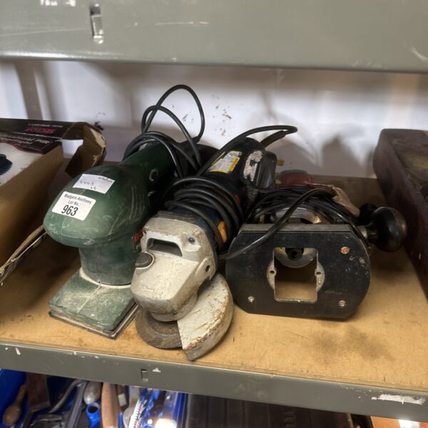 Power tools lot including Bosch sander and Ryobi angle grinder.