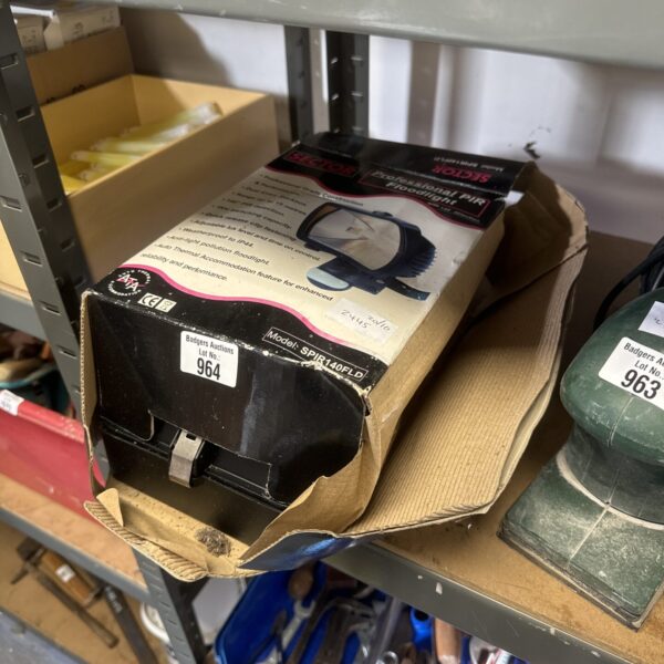 Unused Sector outdoor security light with PIR motion sensor in packaging.