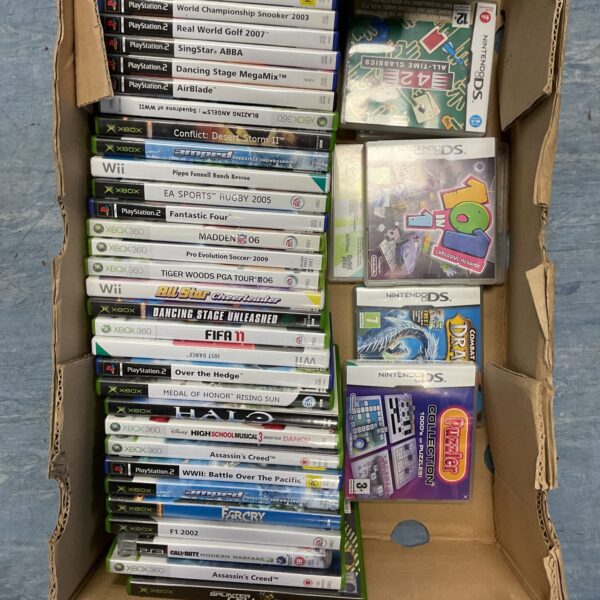 Large collection of video games including Xbox, PlayStation 2, and Nintendo DS titles.