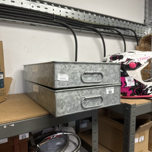 Vintage galvanised steel trays for storage and display.