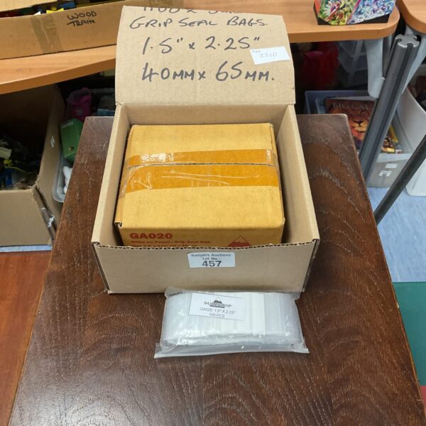 Bulk lot of clear grip seal bags for packaging and storage.