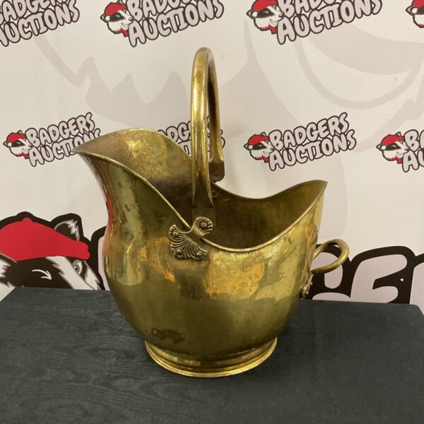 Vintage brass helmet coal scuttle for fireplace use.