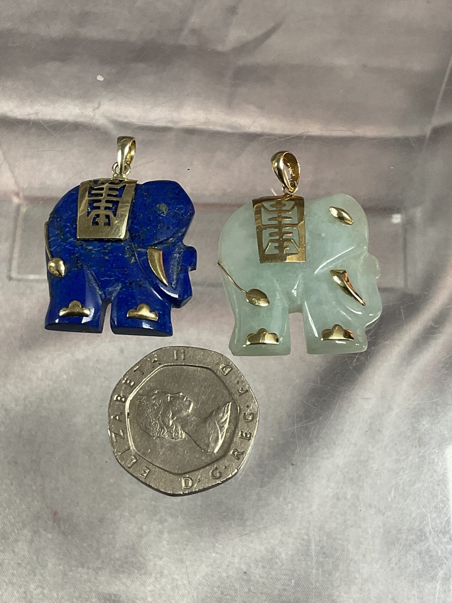 895 14ct Gold mounted Jade and lapis lazuli elephant pendants
