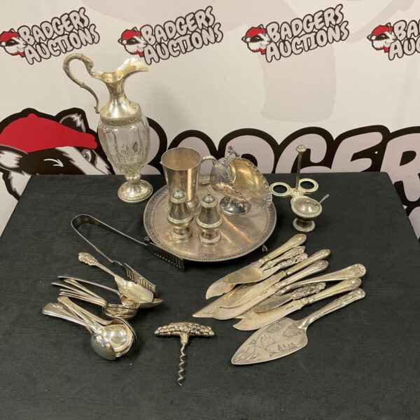 Vintage silver plate cutlery set with serving pieces.