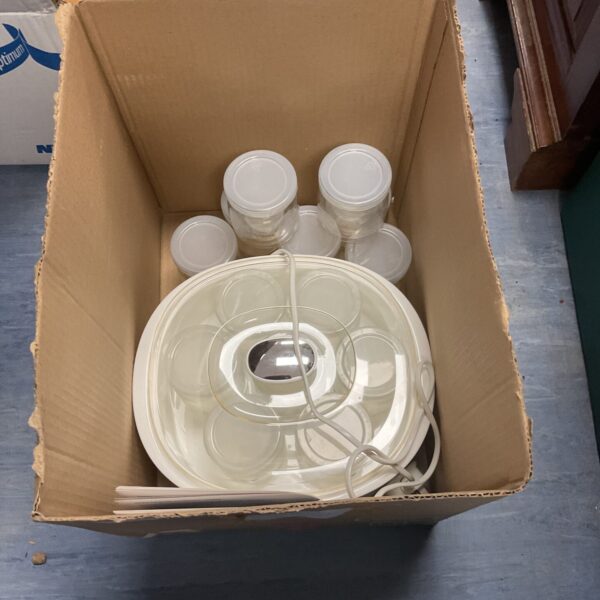 Lakeland yoghurt maker with glass jars and instruction booklet.