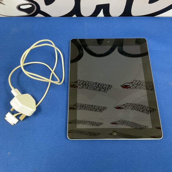 Apple iPad tablet with charger, showing the device and power adapter.