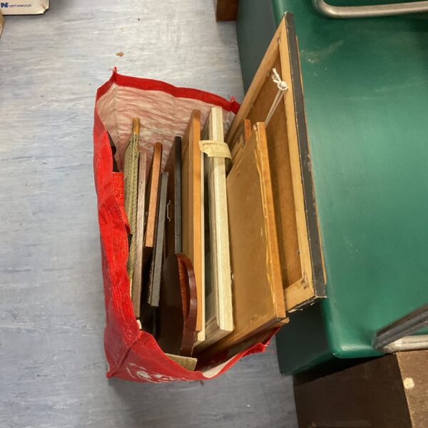 Mixed lot of vintage and family photographs in a red bag.