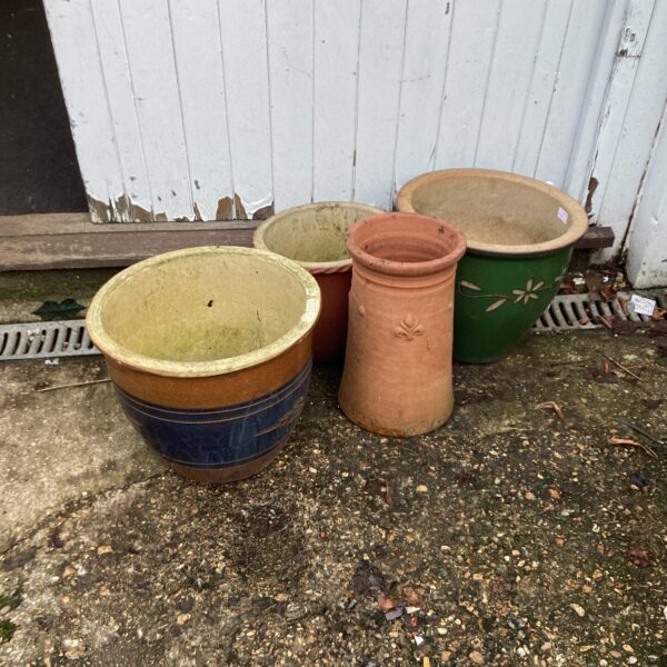 Collection of four vintage garden planters in terracotta and ceramic.