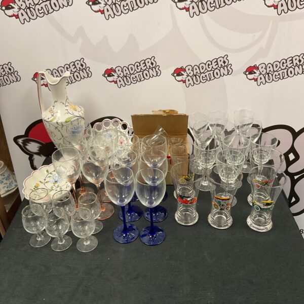 Mixed glassware lot featuring vintage car glasses and pottery.