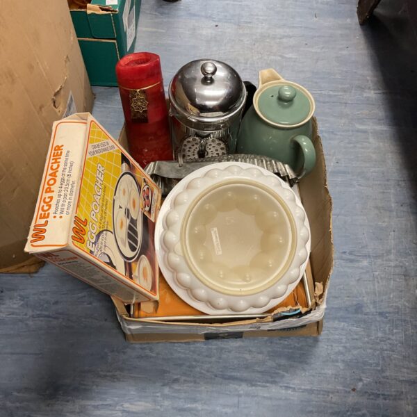 Vintage metal egg poacher with other kitchen items.