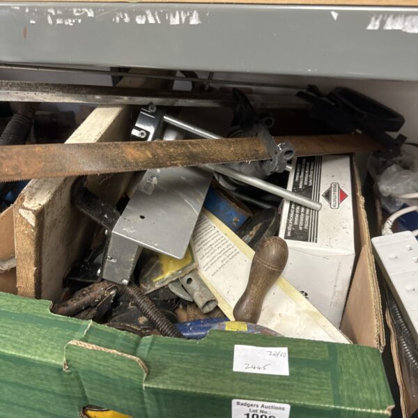 Assorted mitre saw and tool lot for DIY projects.