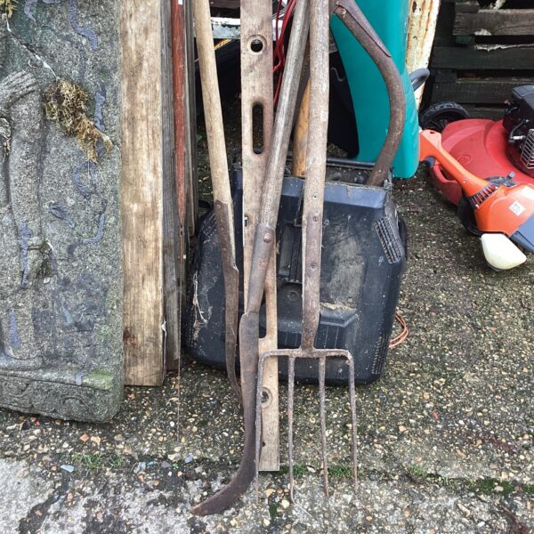 Mixed lot of vintage garden tools including a branch saw.