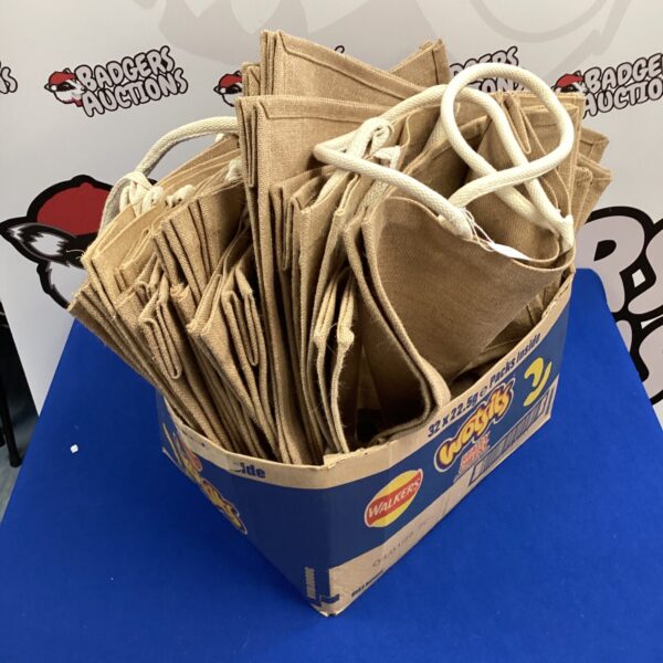Lot of vintage hessian bags for storage and decor.