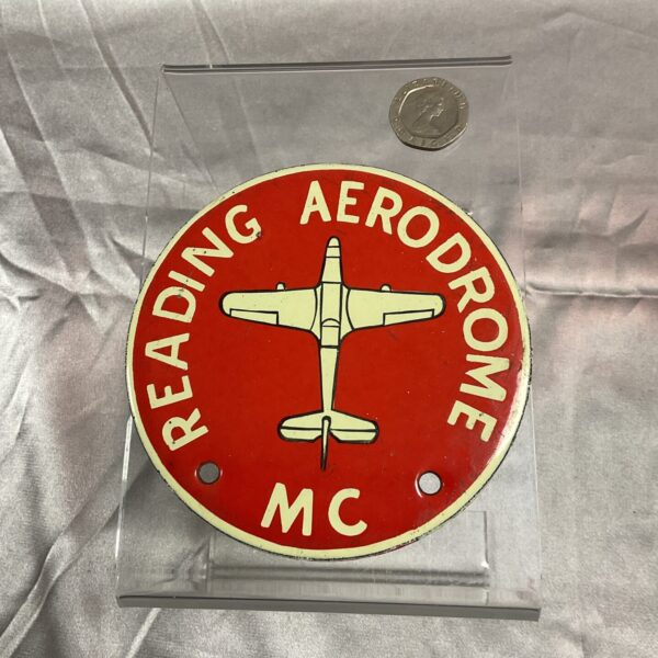Vintage Reading Aerodrome enamel badge with aircraft design.