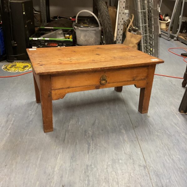Small vintage pine magazine table with drawer, rustic farmhouse style.
