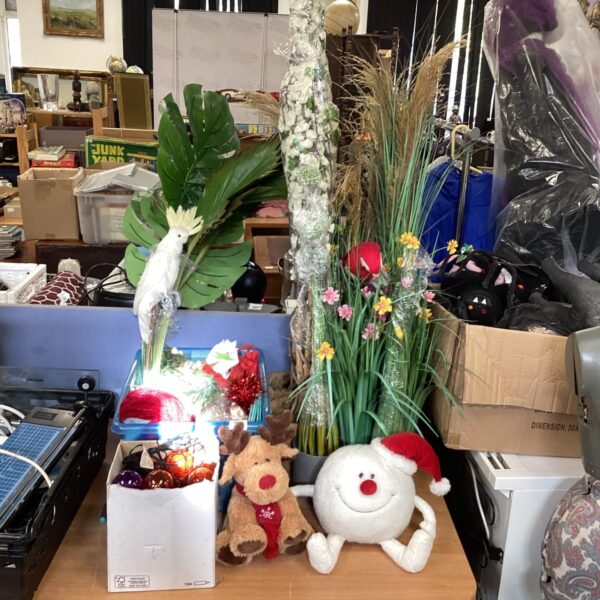 Colourful artificial flowers and Christmas decorations in a mixed lot.