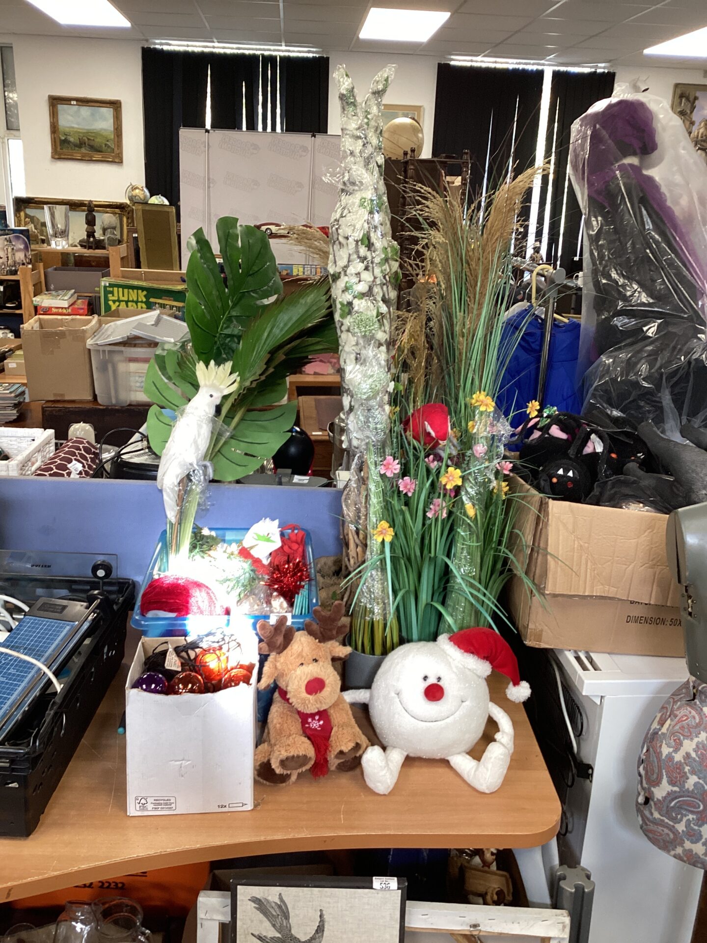 656 Selection of artificial flowers with box of Christmas decorations
