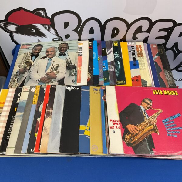 Vintage vinyl record collection in boxes, including Fats Waller and Skid Marks albums.