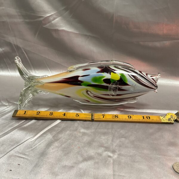 Vibrant Murano glass fish sculpture with colourful swirls.