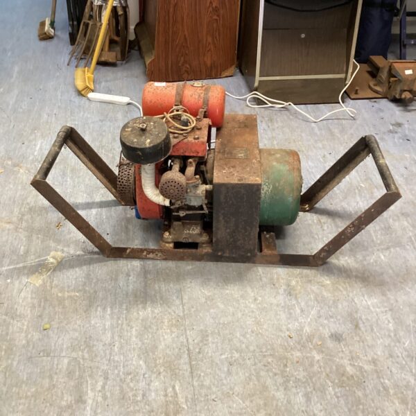 Vintage BBK heavy-duty generator with metal frame and carrying handles.