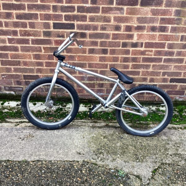 Side view of a used Blank BMX bike for freestyle riding.