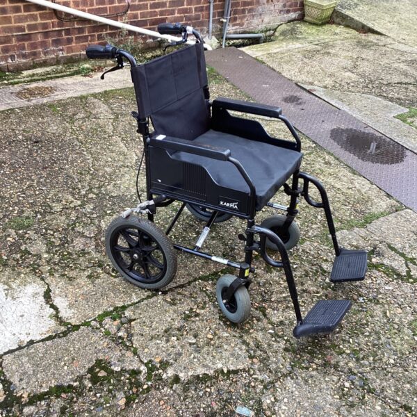 Used Karma folding wheelchair, a lightweight mobility aid.