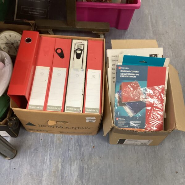 Assorted stationery in cardboard boxes, vintage office supplies.