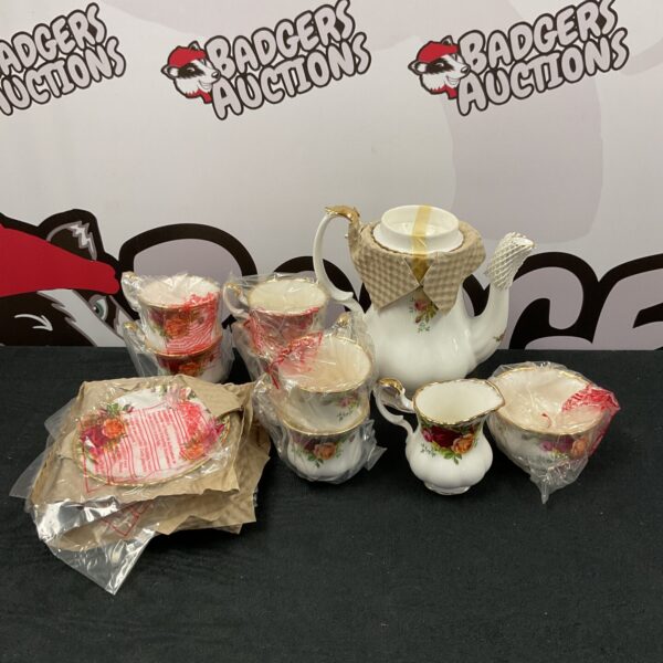 Royal Albert Country Rose coffee set still in original packaging.