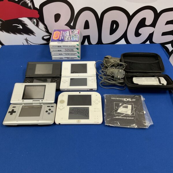 Nintendo DS handheld console lot with games and accessories.