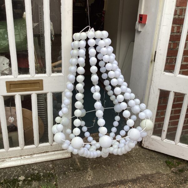 Vintage white plastic chandelier requiring restoration.