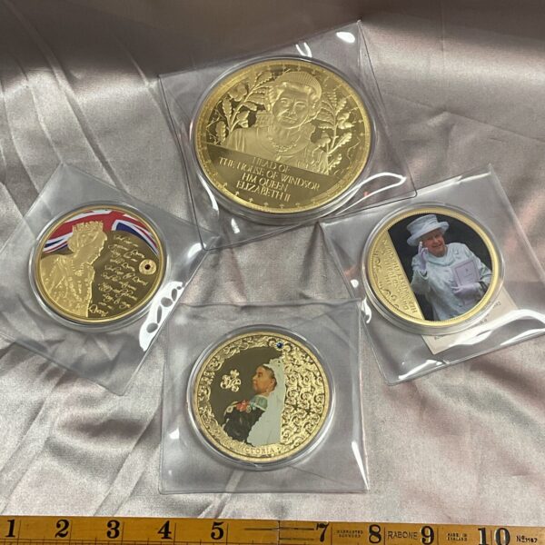 Gold plated Queen Elizabeth II commemorative coin, detailed portrait.