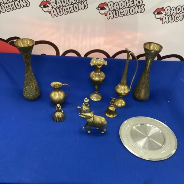 Vintage brassware lot featuring an elephant figurine and decorative vessels.