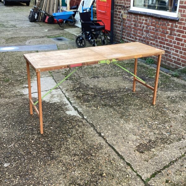 Vintage folding paste table in a garden setting.