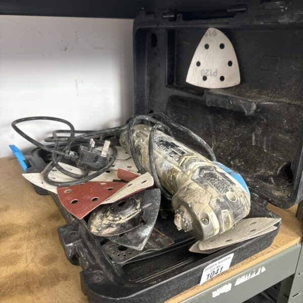 Macallister omnitool with cement residue, offered for spares or repair.
