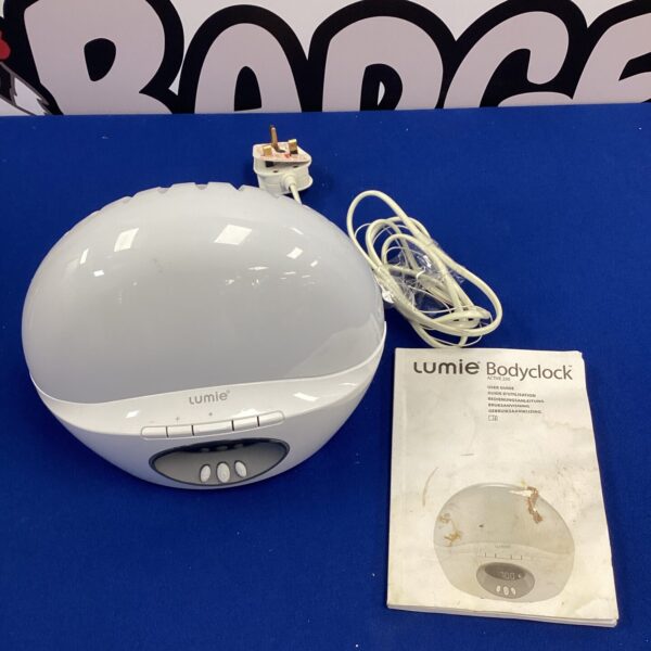 White Lumie Bodyclock radio and night light on a surface.